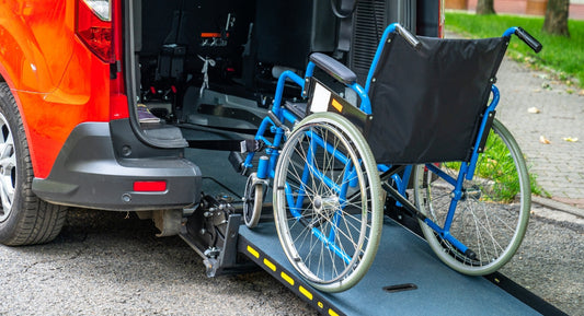 A red adapted Car with a wheel chair