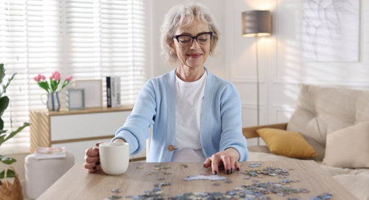 elderly lady playing jigsaw puzzle