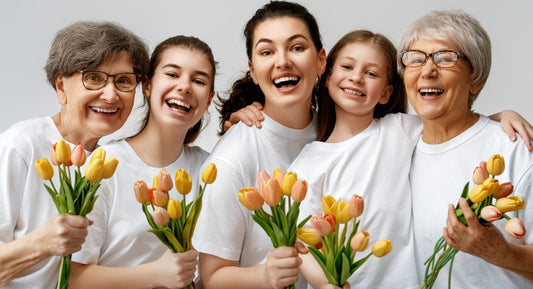 5 diverse women smiling happily