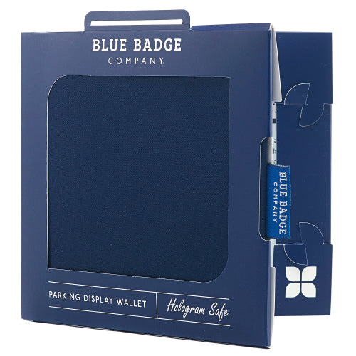 Disabled Blue Badge Wallet in Navy Drill fabric packed in blue badge company recyclable packaging. The Blue Badge Co label sits outside the card box through a side gap. Packaging reads "Blue Badge Company" at the top and "Parking Display Wallet, Hologram Safe" at the bottom.