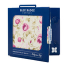 Disabled Blue Badge Wallet in Mullberry Rose fabric is packed in blue badge company recyclable packaging. The Blue Badge Co label sits outside the card box through a side gap. Packaging reads "Blue Badge Company" at the top and "Parking Display Wallet, Hologram Safe" at the bottom.