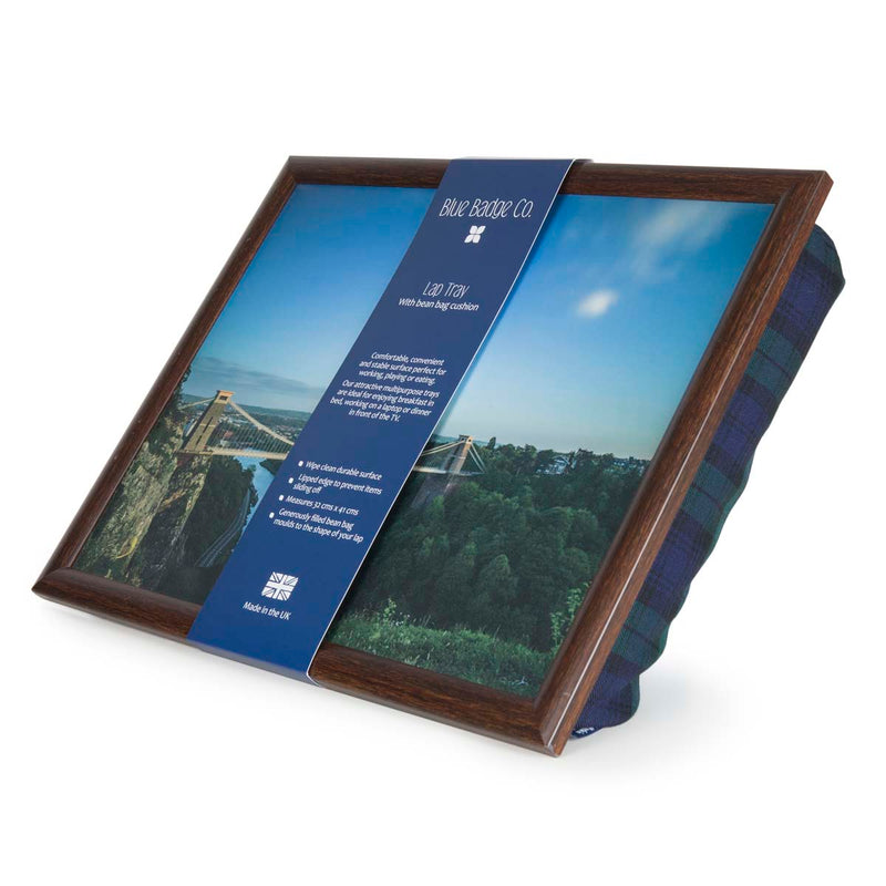 The lap tray is pictured on its side with a band of recyclable card packaging around it. This has the Blue Badge Company name and logo on, along with the lap tray care instructions.