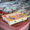 Lap Tray with personalised image of Mother and Doaughter celebrating a birthday on a velvet pink bench in a bedroom