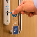 Genuine RADAR Disabled Toilet Key with Blue Heart Comfort Grip and blue badge company kering attached being used in a disabled toilet