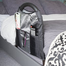 Stander Bedside Econrail portable bed rail with personal items stored inside attached to bed