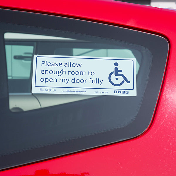 Disabled Car Sticker Rectangle  - Please allow enough room to open my door fully is in use on the inside of a car window