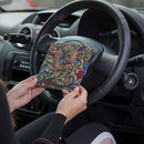 Blue Badge Wallet in William Morris Golden Lily fabric is held in two hands against a steering wheel.