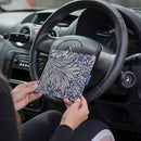 Blue Badge Wallet in William Morris Marigold Indigo fabric is held in two hands against a steering wheel.