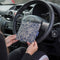 Blue Badge Wallet in William Morris Marigold Indigo fabric is held in two hands against a steering wheel.