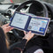 Open Disabled Blue Badge Wallet held in two hands against a steering wheel. The adjustable timer display clock is on the left. On the right is a Devon County Council Disabled Parking Permit with hologram. The acetate window doesn't cover the hologram.