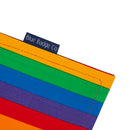 A close up of the Rainbow fabric wallet with a Blue Badge Co label. 