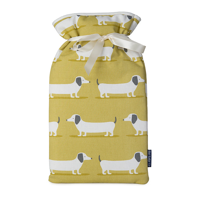 Large Hot Water Bottle in Sausage Dog with white satin ribbon and blue badge company label showing