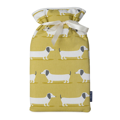 Large Hot Water Bottle in Sausage Dog with white satin ribbon and blue badge company label showing