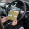 Blue Badge Wallet in Sausage Dog fabric is held in two hands against a steering wheel.